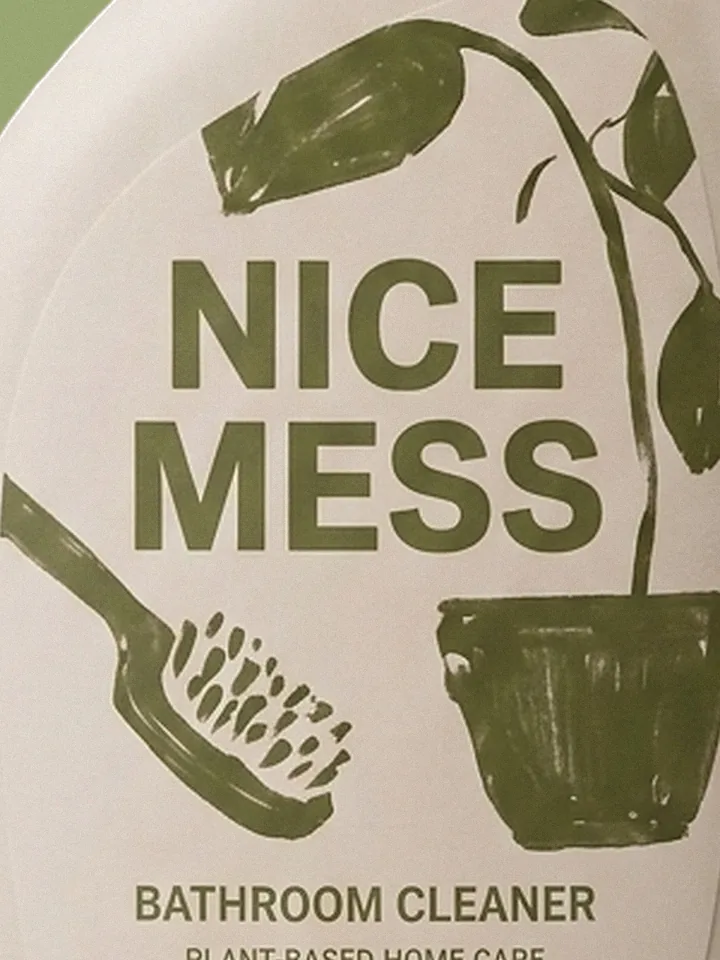 Close-up of the plant and scrubbing-brush illustration on the Bathroom Cleaner label